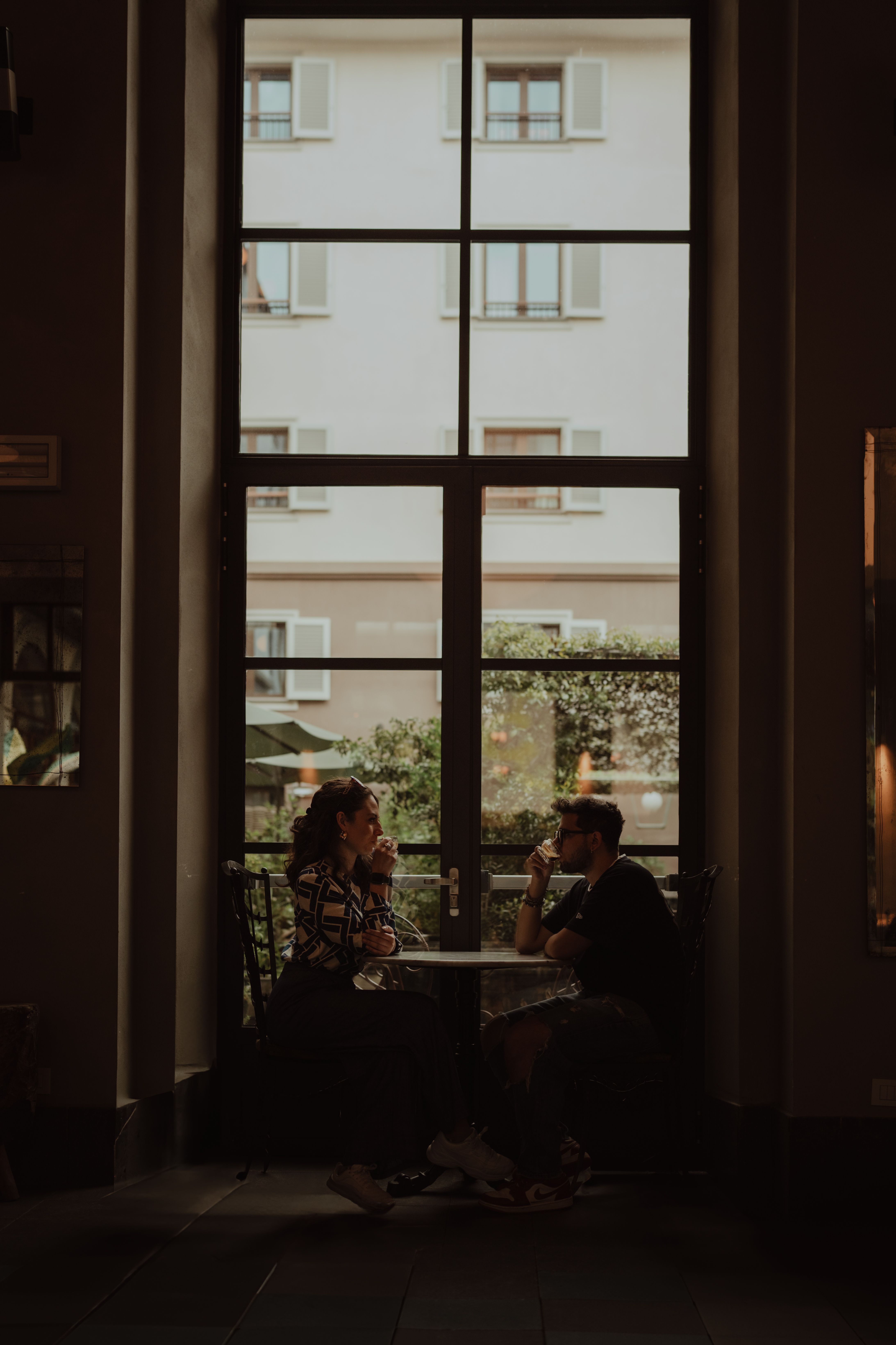 Friends enjoying coffee together inside Slow Brew